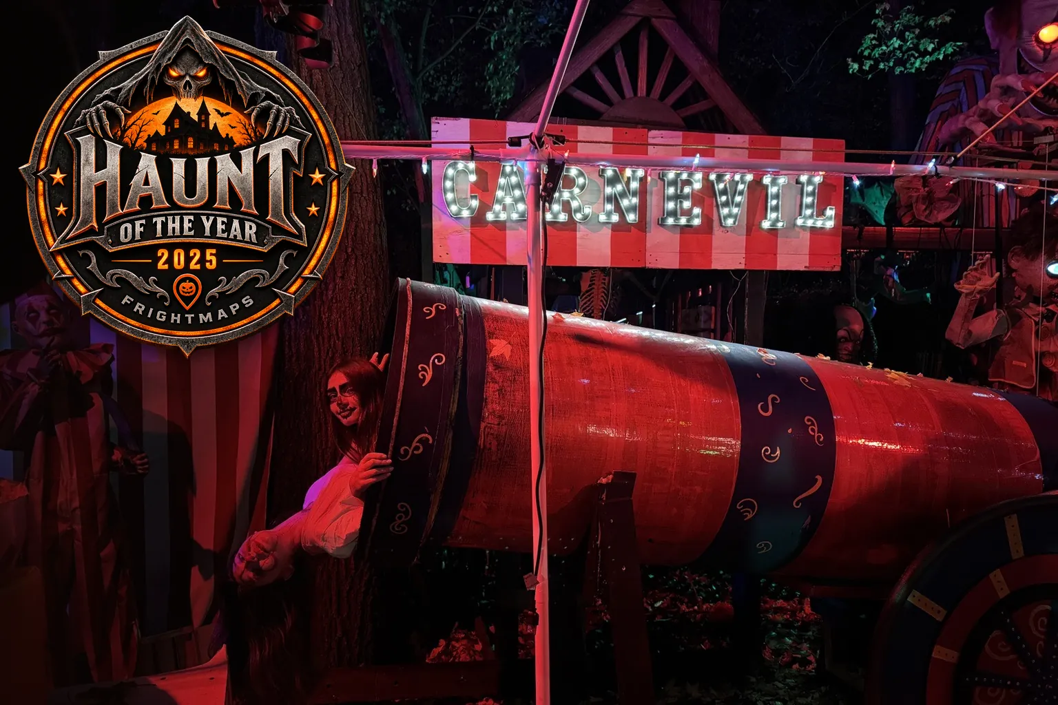 The FrightMaps Haunt of the Year 2025 badge over the CARNEVIL sideshow at Twisted Trails at night.