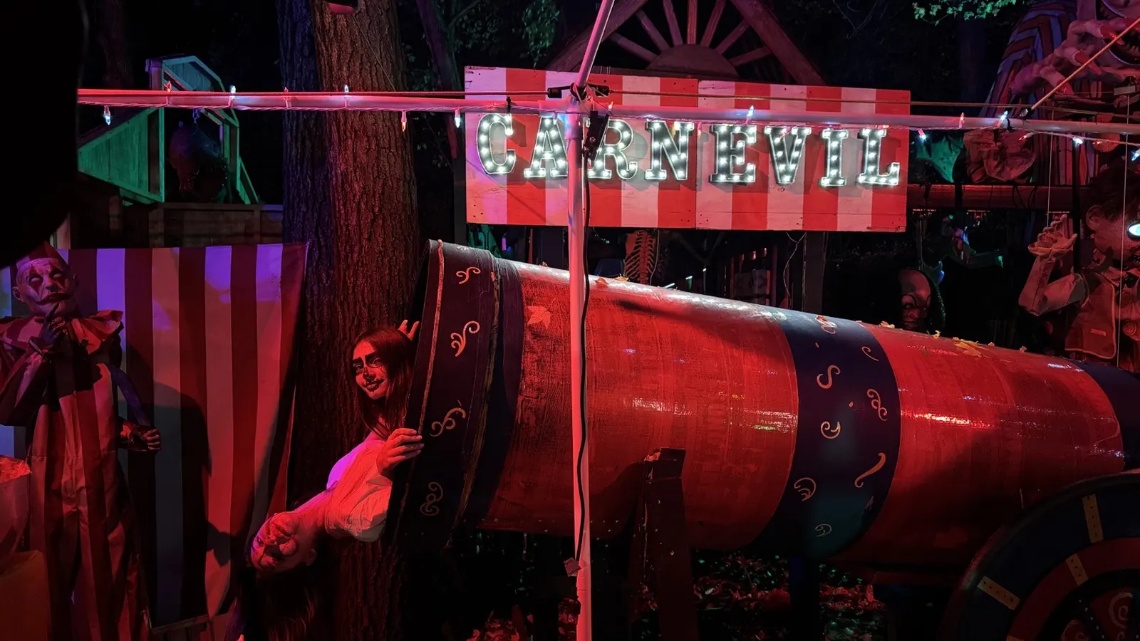 The CARNEVIL sideshow at Twisted Trails at night.